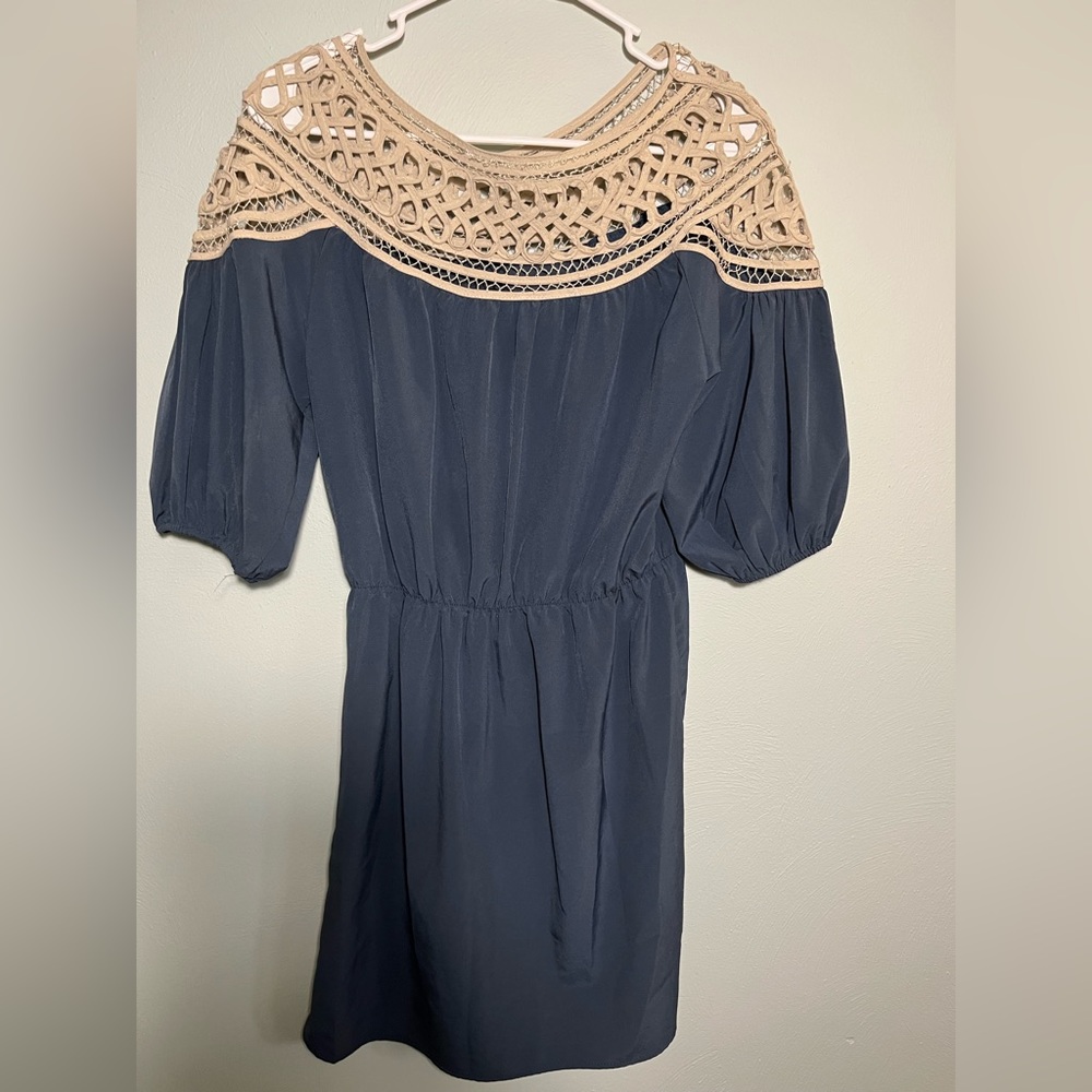 Esley. Short lightweight dress with lattice accent at top.